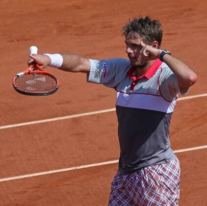 Stan Wawrinka of Switzerland reacts after winning his French Open men s semifinal match against Jo-Wilfried Tsonga of France at Roland Garros in Paris on June 5, 2015. Wawrinka defeated Tsonga 6-3, 6-7 (1), 7-6 (3), 6-4 to advance to the final round.  PAR20150605728 DAVIDxSILPA