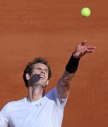Andy Murray of Great Britain hits a serve during his French Open men s semifinal match against Novak Djokovic of Serbia at Roland Garros in Paris on June 5, 2015.  PAR20150605737 DAVIDxSILPA