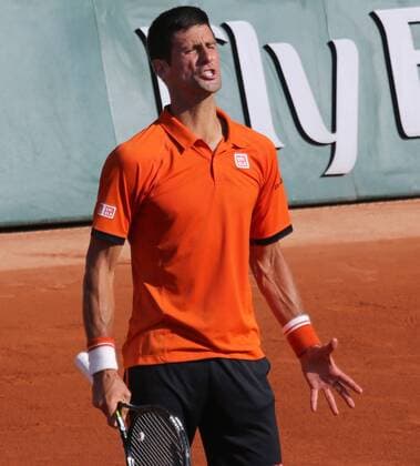 Novak Djokovic of Serbia reacts after a shot during his French Open men s semifinal match against Andy Murray of Great Britain at Roland Garros in Paris on June 5, 2015.  PAR20150605741 DAVIDxSILPA