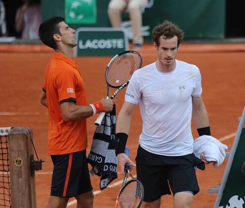 Novak Djokovic of Serbia (L) meets Andy Murray of Great Britain at the umpire s chair during their French Open men s semifinal match at Roland Garros in Paris on June 5, 2015. Play was suspended due to rain and darkness with Djokovic leading 6-3, 6-3, 5-7, 3-3.  PAR20150605753 DAVIDxSILPA