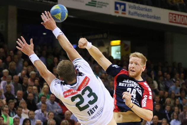 Flensburg, 30. May 2015 Handball, Saison 2014 2015, Bundesliga, 33. Spieltag, SG Flensburg-Handewitt - HSG Wetzlar: Steffen Fäth (HSG Wetzlar, 23), Jim Gottfridsson (SG Flensburg-Handewitt, 24)
