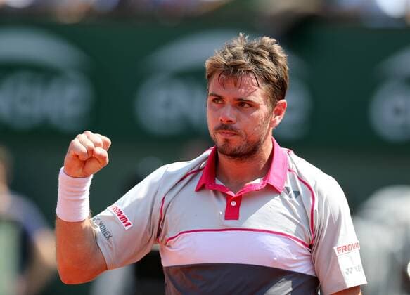 Stan Wawrinka of Switzerland celebrates during the men s singles semifinal against Jo-Wilfried Tsonga of France at 2015 French Open tennis tournament at Roland Garros in Paris June 5, 2015. Wawrinka won 3-1 and advanced to the final. ) (SP)FRANCE-PARIS-TENNIS-FRENCH OPEN HanxYan 