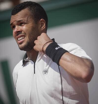 Jo-Wilfried Tsonga of France reacts during the men s singles semifinal against Stan Wawrinka of Switzerland at 2015 French Open tennis tournament at Roland Garros in Paris June 5, 2015. Wawrinka won 3-1 and advanced to the final. ) (SP)FRANCE-PARIS-TENNIS-FRENCH OPEN ChenxXiaowei 