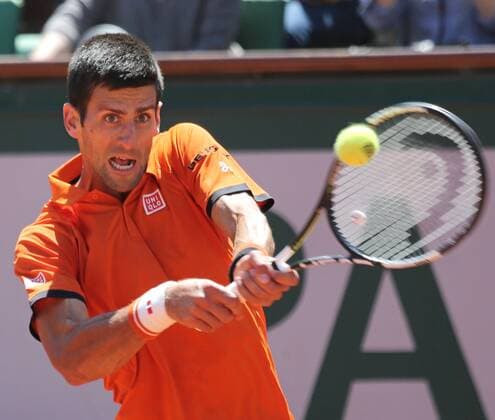 Novak Djokovic of Serbia hits a shot during his French Open men s semifinal match against Andy Murray of Great Britain at Roland Garros in Paris on June 6, 2015. Djokovic defeated Murray 6-3, 6-3, 5-7, 5-7, 6-1.  PAR20150606708 DAVIDxSILPA