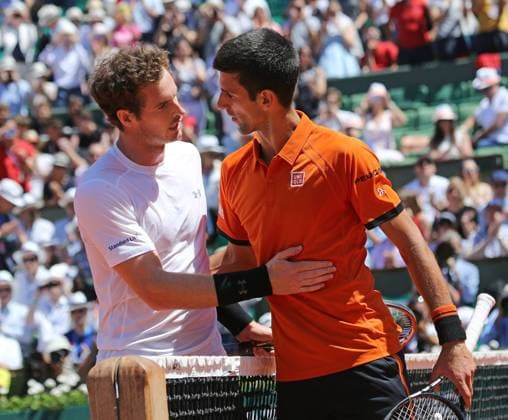 Andy Murray (L) of Great Britain meets Novak Djokovic of Serbia at the net after their French Open men s semifinal match at Roland Garros in Paris on June 6, 2015. Djokovic defeated Murray 6-3, 6-3, 5-7, 5-7, 6-1.  PAR20150606710 DAVIDxSILPA