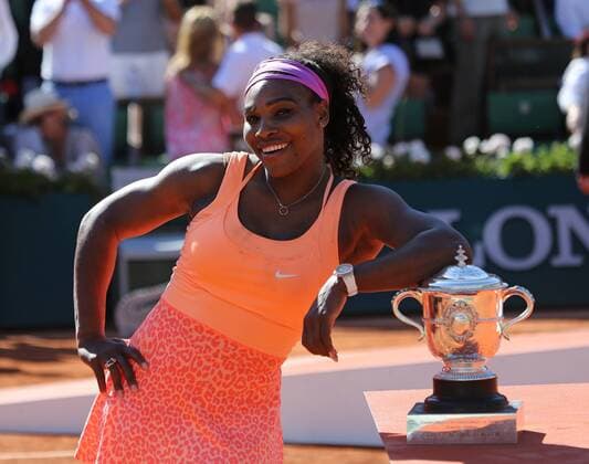 American Serena Williams holds the championship trophy after winning her French Open women s final match against Lucie Safarova of the Czech Republic at Roland Garros in Paris on June 6, 2015. Williams defeated Safarova 6-3, 6-7 (2), 6-2 to win her third French Open title.  PAR20150606724 DAVIDxSILPA