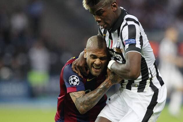 SOCCER - CL, Barcelona vs Juventus BERLIN,GERMANY,06.JUN.15 - SOCCER - UEFA Champions League Final, FC Barcelona Barca vs Juventus Turin. Image shows Daniel Alves (Barcelona) and Paul Pogba (Turin). GEPAxpictures xMathiasxMandl
