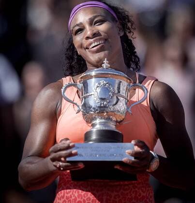 Serena Williams of the United States celebrates with her trophy after the women s singles final against Lucie Safarova of Czech Republic at 2015 French Open tennis tournament at Roland Garros, in Paris, France on June 6, 2015. Serena Williams claimed the 20th Grand Slam title by winning 2-1. ) (SP) FRANCE-PARIS-TENNIS-ROLAND GARROS-WOMEN S FINAL ChenxXiaowei 