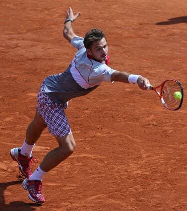 Stan Wawrinka of Switzerland hits a shot during his French Open men s final match against Novak Djokovic of Serbia at Roland Garros in Paris on June 7, 2015.  PAR20150607706 DAVIDxSILPA