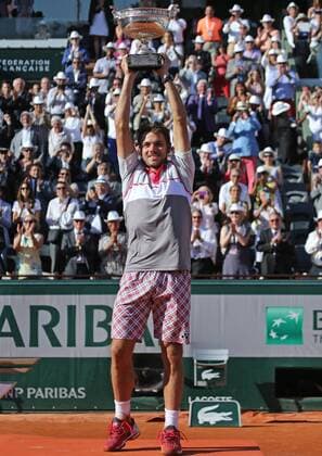 Stan Wawrinka of Switzerland holds the championship trophy after winning his French Open men s final match against Novak Djokovic of Serbia at Roland Garros in Paris on June 7, 2015. Wawrinka defeated Djokovic 4-6, 6-4, 6-3, 6-4 to win his first French Open championship.  PAR20150607711 DAVIDxSILPA