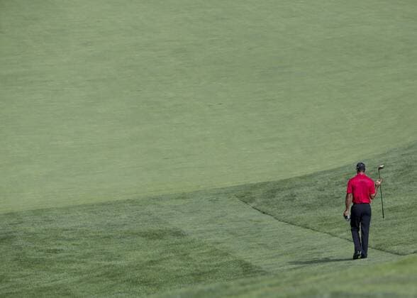 June 07 2015: Tiger Woods walking down the hill to the fairway of the 11th tee during the final round of the Memorial Tournament held at the Muirfield Village Golf Club in Dublin, Ohio. GOLF: JUN 07 PGA Golf Herren - the Memorial Tournament - Final Round Icon150607012 EDITORIAL USE ONLY