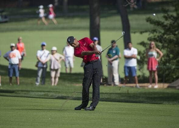 June 07 2015: Tiger Woods hitting from the fairway of the 14th hole during the final round of the Memorial Tournament held at the Muirfield Village Golf Club in Dublin, Ohio. GOLF: JUN 07 PGA Golf Herren - the Memorial Tournament - Final Round Icon150607015 EDITORIAL USE ONLY