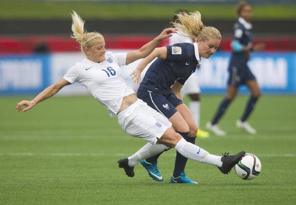 (150609) -- MONCTON, June 9, 2015 -- Katie Chapman(L) of England vies with Amandine Henry of France during their group F match at the 2015 FIFA Women s World Cup in Moncton, Canada, June 9, 2015. France won 1-0. ) (SP)CANADA-MONCTON-FIFA WOMEN S WORLD CUP-GROUP F-FRANCE VS ENGLAND ZouxZheng 