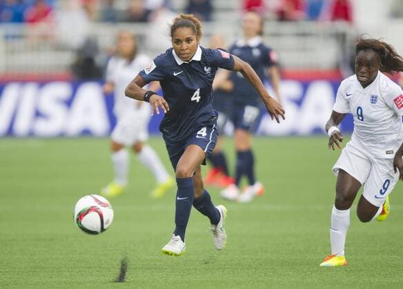 (150609) -- MONCTON, June 9, 2015 -- Eniola Aluko(R) of England vies with Laura Georges of France during their group F match at the 2015 FIFA Women s World Cup in Moncton, Canada, June 9, 2015. France won 1-0. ) (SP)CANADA-MONCTON-FIFA WOMEN S WORLD CUP-GROUP F-FRANCE VS ENGLAND ZouxZheng 