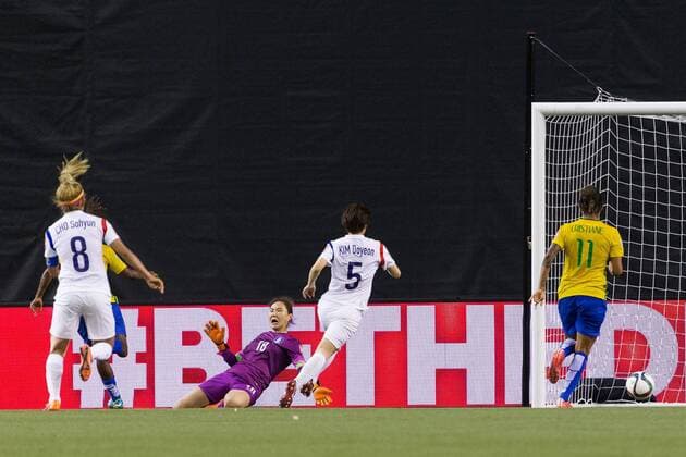 June 09, 2015 : Brazil midfielder Formiga 20 scores a goal against Korea goalkeeper Kim Jungmi 18 during the 2015 FIFA Women s World Cup Group E match between Brazil and Korea at the Olympic Stadium in Montreal, Quebec, Canada. SOCCER: JUN 09 FIFA Women s World Cup - Group E - Brazil v Korea Icon15060905 EDITORIAL USE ONLY
