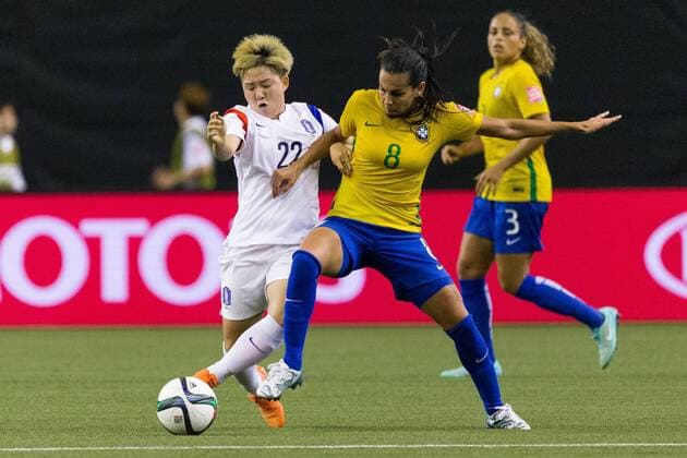 June 09, 2015 : Korea midfielder Lee Sodam 22 and Brazil midfielder Thaisa 8 fight for the ball during the 2015 FIFA Women s World Cup Group E match between Brazil and Korea at the Olympic Stadium in Montreal, Quebec, Canada. SOCCER: JUN 09 FIFA Women s World Cup - Group E - Brazil v Korea Icon15060920 EDITORIAL USE ONLY