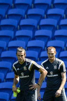 - CARDIFF, UNITED KINGDOM: Wales Gareth Bale and Wales Shaun MacDonald pictured during a training session of the Welsh national soccer team, Thursday 11 June 2015, in Cardiff, Wales, United Kingdom. The Welsh team plays against Belgian national soccer team Red Devils in a Euro 2016 qualification game on Friday. DIRKxWAEM  x04640507x