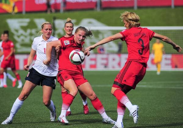 June 11, 2015 - Ottawa, Ontario, Canada - June 11, 2015: Defender Saskia Bertusiak ( 3) of Germany clears the ball as Tabea Kemme ( 22) holds off Kristine Minde ( 19) of Norway during the FIFA 2015 Women s World Cup Group B match between Germany and Norway at Lansdowne Stadium in Ottawa, Canada. Soccer: FIFA 2015 Women s World Cup Group B Match - Germany versus Norway. - ZUMAk120