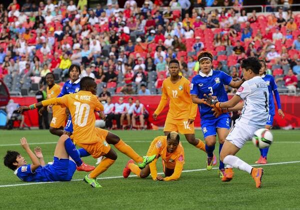 June 11, 2015 - Ottawa, Ontario, Canada - June 11, 2015: Forward Ange Nguessan ( 10) of Câ ¢te dÃ Ivoire scores the opening goal during the FIFA 2015 Women s World Cup Group B match between Câ ¢te dÃ Ivoire and Thailand at Lansdowne Park in Ottawa, Canada. Soccer: FIFA 2015 Women s World Cup Group B Match - C™te dÕIvoire versus Thailand. - ZUMAk120