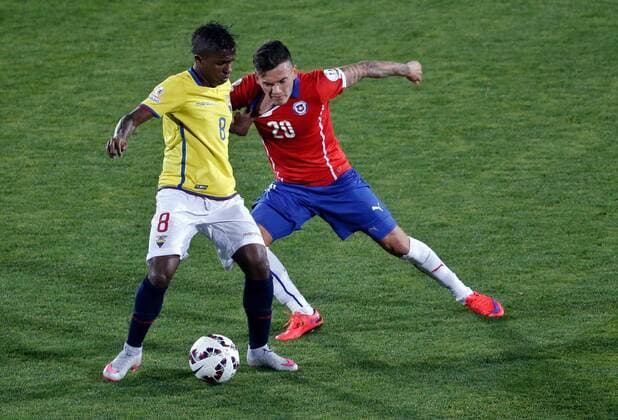 SANTIAGO, June 11, 2015 -- Charles Aranguiz (R) of Chile vies for the ball with Miller Bolanos (L) from Ecuador, during the opening match of the Copa America 2015, in Santiago, capital of Chile, on June 11, 2015. Chile won 1-0. 
