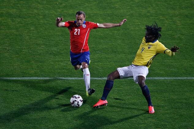 SANTIAGO, June 11, 2015 -- Marcelo Diaz (L) from Chile vies for the ball with Juan Paredes (R) from Ecuador during the opening match of the Copa America 2015, in Santiago, capital of Chile, on June 11, 2015. Chile won 1-0. 