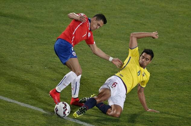 SANTIAGO, June 11, 2015 -- Alexis Sanchez (L) of Chile vies for the ball with Christian Noboa (R) from Ecuador during the opening match of the Copa America 2015, in Santiago, capital of Chile, on June 11, 2015. Chile won 1-0. 
