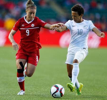 EDMONTON, June 11, 2015 -- Josee Belanger (L)of Canada vies with Sarah Gregorius of New Zealand during the Group A match between Canada and New Zealand at Commonwealth Stadium in Edmonton, Canada on June 11, 2015. The match ended with a 0-0 draw. ) (SP)CANADA-EDMONTON-FIFA WOMEN S WORLD CUP-CAN VS NZL WangxLili 