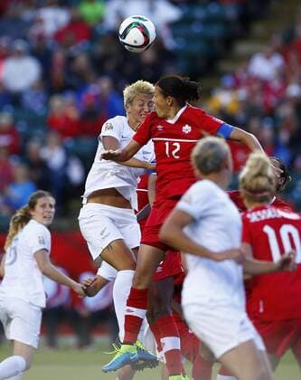 EDMONTON, June 11, 2015 -- Canada s Christine Sinclair (Top R) vies with New Zealand s Abby Erceg during the Group A match at Commonwealth Stadium in Edmonton, Canada on June 11, 2015. The match ended with a 0-0 draw. ) (SP)CANADA-EDMONTON-FIFA WOMEN S WORLD CUP-CAN VS NZL DingxXu 
