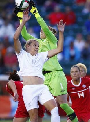 EDMONTON, June 11, 2015 -- Canada s goalkeeper Erin McLeod (Top) vies with New Zealand s Kirsty Yallop (front) during their Group A match at Commonwealth Stadium in Edmonton, Canada on June 11, 2015. The match ended with a 0-0 draw. ) (SP)CANADA-EDMONTON-FIFA WOMEN S WORLD CUP-CAN VS NZL DingxXu 