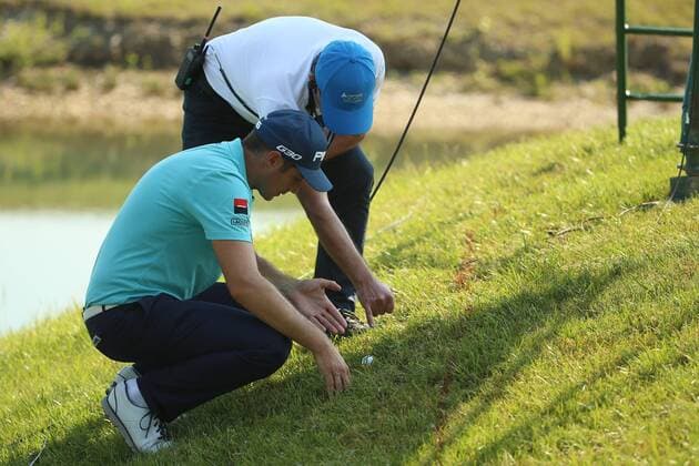 GOLF - Lyoness Open 2015 ATZENBRUGG,AUSTRIA,12.JUN.15 - GOLF - PGA Golf Herren European Tour, Lyoness Open, Diamond Country Club. Image shows Julien Quesne (FRA) and a referee. GEPAxpictures xDanielxGoetzhaber
