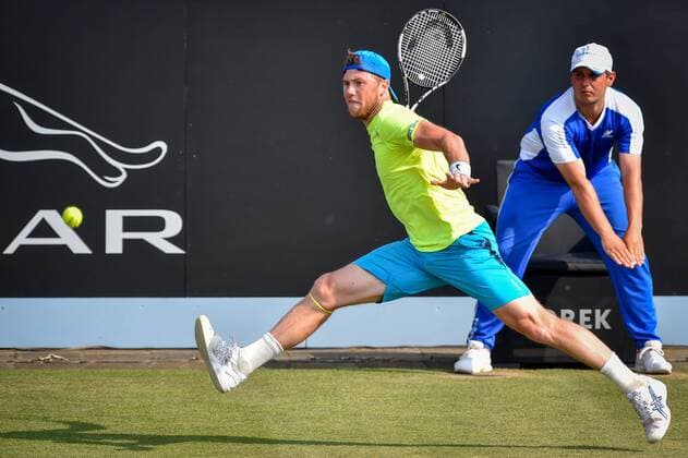 - ROSMALEN, NETHERLANDS: Ukrainian Illya Marchenko pictured in action during a tennis game between Belgian David Goffin and Ukrainian Illya Marchenko in the third round of the men s tournament at the Topshelf Open WTA Tennis Damen tennis tournament in Rosmalen, the Netherlands, Friday 12 June 2015. LUCxCLAESSEN  x04641677x