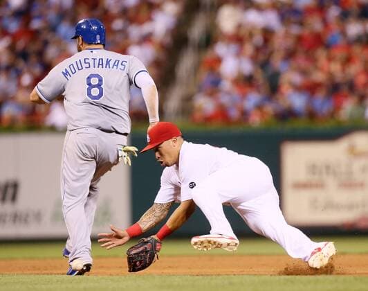 June 12, 2015 - St Louis, MO, USA - St. Louis Cardinals second baseman Kolten Wong loses his footing as he tries to field a ground ball off the bat of the Kansas City Royals Lorenzo Cain as Mike Moustakas (8) advances to second in the sixth inning on Friday, June 12, 2015, at Busch Stadium in St. Louis. Kansas City at St. Louis - ZUMAm67_