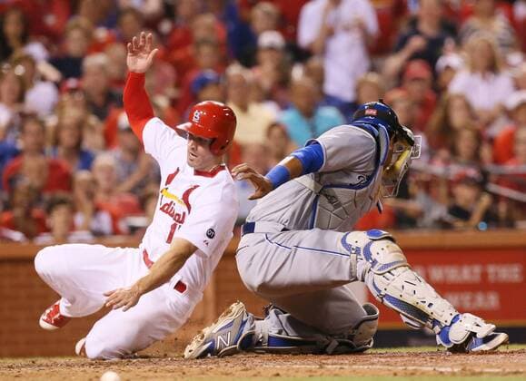 June 12, 2015 - St Louis, MO, USA - The St. Louis Cardinals Randal Grichuk scores on a sacrifice fly past Kansas City Royals catcher Salvador Perez in the eighth inning on Friday, June 12, 2015, at Busch Stadium in St. Louis. The Cards won, 4-0. Kansas City at St. Louis - ZUMAm67_