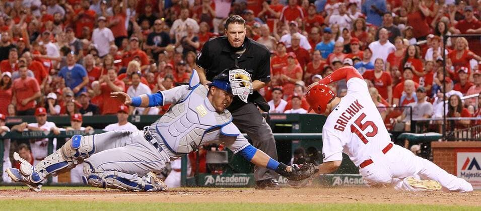 June 12, 2015 - St Louis, MO, USA - The St. Louis Cardinals Randal Grichuk scores on a sacrifice fly past Kansas City Royals catcher Salvador Perez in the eighth inning on Friday, June 12, 2015, at Busch Stadium in St. Louis. In background is home plate umpire Tony Randazzo. Kansas City at St. Louis - ZUMAm67_