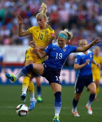 (150613) -- WINNIPEG, June 12, 2015 -- Julie Johnston (R) of the United States vies with Sofia Jakobsson of Sweden during their Group D match between the United States and Sweden at Winnipeg Stadium in Winnipeg, Canada on June 12, 2015. ) (SP)CANADA-WINNIPEG-FIFA-WOMEN S WORLD CUP-USA VS SWE WangxLili 