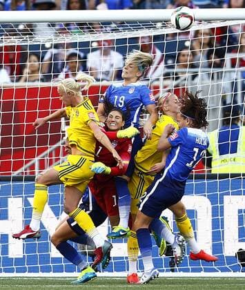 (150613) -- WINNIPEG, June 12, 2015 -- Hope Solo (2nd L), goalkeeper of the United States, saves the ball during their Group D match against Sweden at Winnipeg Stadium in Winnipeg, Canada on June 12, 2015. ) (SP)CANADA-WINNIPEG-FIFA-WOMEN S WORLD CUP-USA VS SWE DingxXu 