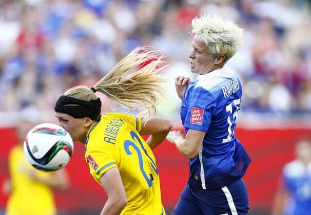 (150613) -- WINNIPEG, June 12, 2015 -- Megan Rapinoe (R) of the United States vies with Olivia Schough of Sweden during their Group D match at Winnipeg Stadium in Winnipeg, Canada on June 12, 2015. ) (SP)CANADA-WINNIPEG-FIFA-WOMEN S WORLD CUP-USA VS SWE DingxXu 