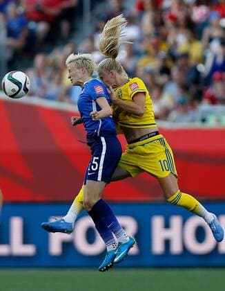 (150613) -- WINNIPEG, June 12, 2015 -- Megan Rapinoe (L) of the United States vies with Sofia Jakobsson of Sweden during a Group D match between the United States and Sweden at Winnipeg Stadium in Winnipeg, Canada on June 12, 2015. The match ended 0-0. ) (SP)CANADA-WINNIPEG-FIFA-WOMEN S WORLD CUP-USA VS SWE WangxLili 