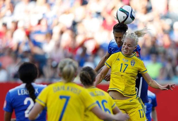 (150613) -- WINNIPEG, June 12, 2015 -- Carli Lloyd (top) of the United States vies with Caroline Seger of Sweden during a Group D match at Winnipeg Stadium in Winnipeg, Canada on June 12, 2015. The match ended 0-0. ) (SP)CANADA-WINNIPEG-FIFA-WOMEN S WORLD CUP-USA VS SWE WangxLili 