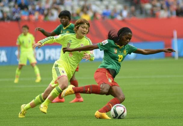 Claudine Meffometou Tcheno (R) vies with Mizuho Sakaguchi of Japan during their group C match against Ecuador at the 2015 FIFA Women s World Cup in Vancouver, Canada, on June 12, 2015. Japan won 2-1.(Xinhua Sergei Bachlakov) (SP)CANADA-VANCOUVER-FIFA-WOMEN S WORLD CUP-JPN VS CMR 