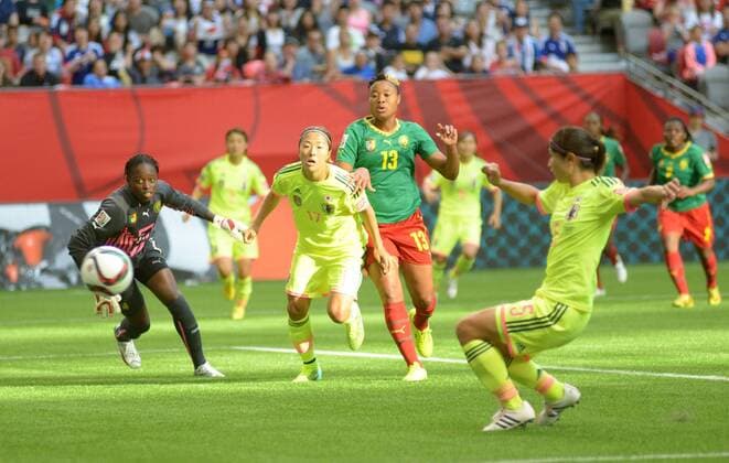Players of Japan and Cameroon battle during their group C match against Ecuador at the 2015 FIFA Women s World Cup in Vancouver, Canada, on June 12, 2015. (Xinhua Sergei Bachlakov) (SP)CANADA-VANCOUVER-FIFA-WOMEN S WORLD CUP-JPN VS CMR 
