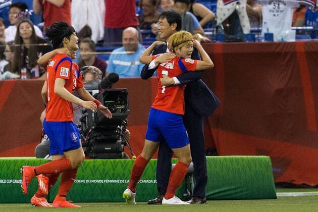 June 13, 2015 : Korea midfielder Jeon Gaeul 7 celebrates a goal with head coach Yoon Dukyeo during the 2015 FIFA Women s World Cup Group E match between Korea and Costa Rica at the Olympic Stadium in Montreal, Quebec, Canada. SOCCER: JUN 13 FIFA Women s World Cup - Group E - Korea v Costa Rica Icon15061302 EDITORIAL USE ONLY