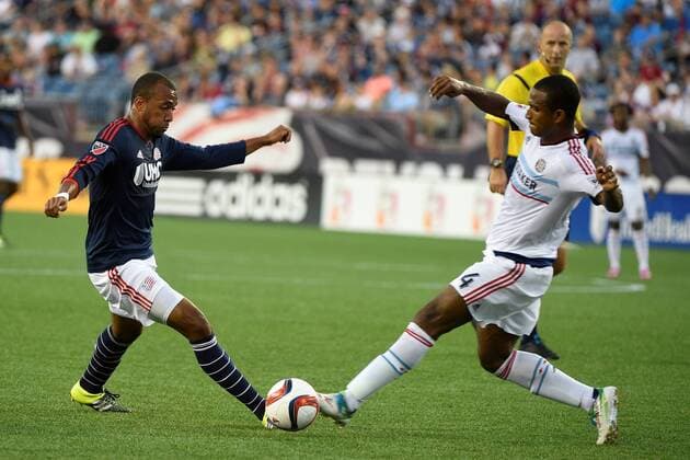 June 13, 2015 - Foxborough, Massachusetts, U.S. - New England Revolution forward Teal Bunbury (10) and Chicago Fire defender Adailton (4) reach the ball at the same time during the MLS Fussball Herren USA game between Chicago Fire and the New England Revolution held at Gillette Stadium in Foxborough Massachusetts. Eric Canha CSM MLS 2015: Fire vs Revolution JUN 13 - ZUMAc04_