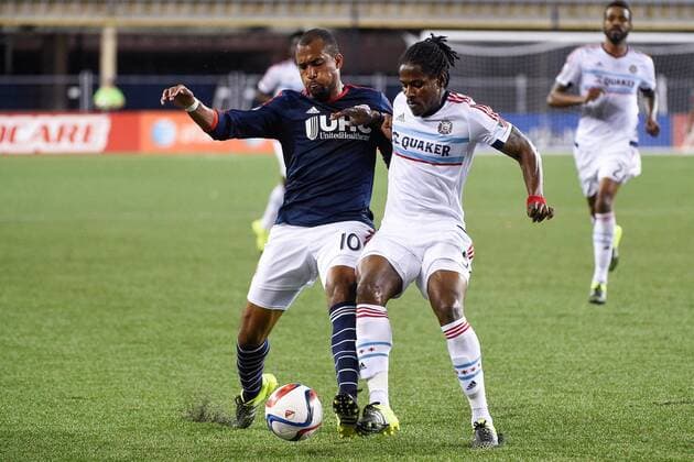 June 13, 2015 - Foxborough, Massachusetts, U.S. - New England Revolution forward Teal Bunbury (10) and Chicago Fire defender Lovel Palmer (5) battle for control of the ball during the MLS Fussball Herren USA game between Chicago Fire and the New England Revolution held at Gillette Stadium in Foxborough Massachusetts. The Revolution defeated the Fire 2-0. Eric Canha CSM MLS 2015: Fire vs Revolution JUN 13 - ZUMAc04_