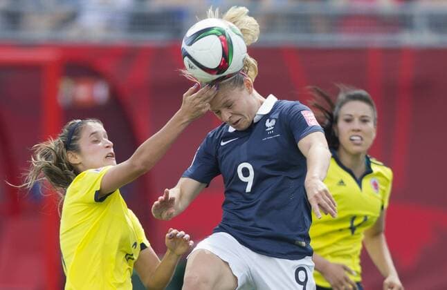(150613) -- MONCTON, June 13, 2015 -- Eugenie Le Sommer (C) of France vies with Daniela Montoya (L) of Colombia at a group F match at the 2015 FIFA Women s World Cup in Moncton, Canada, June 13, 2015. Colombia won 2-0. ) (SP)CANADA-MONCTON-FIFA WOMEN S WORLD CUP-GROUP F-FRANCE VS COLOMBIA ZouxZheng 