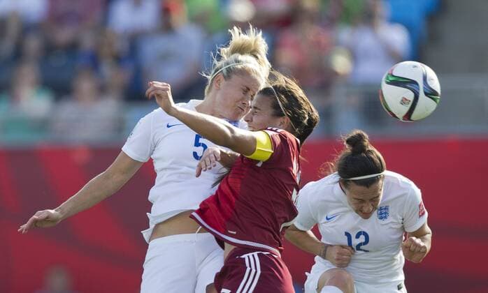 (150614) -- MONCTON, June 14, 2015 -- Steph Houghton(L) of England vies with Nayeli Rangel(C) of Mexico during their group F match at the 2015 FIFA Women s World Cup in Moncton, Canada, June 13, 2015. England won 2-1. ) (SP)CANADA-MONCTON-FIFA WOMEN S WORLD CUP-GROUP F-ENGLAND VS MEXICO ZouxZheng 