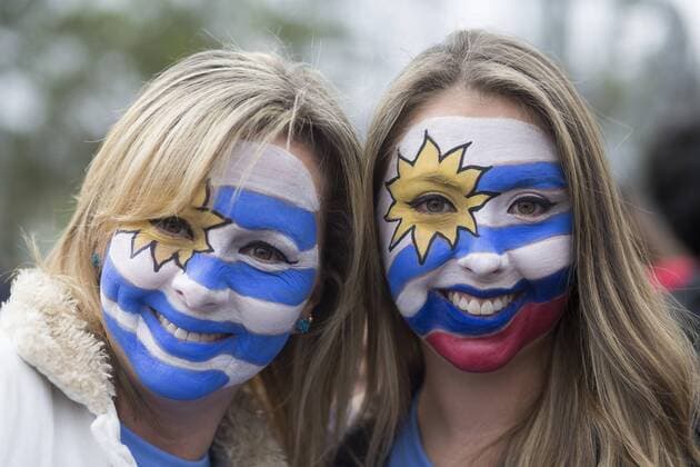 (150614) -- ANTOFAGASTA, June 14, 2015 -- Two fans of Uruguay pose for photos ahead of a Group B match between Uruguay and Jamaica at Copa America 2015 , in Antofagasta, Chile, on June 13, 2015. ) (SP)CHILE-ANTOFAGASTA-COPA AMERICA-GROUP B-URUGUAY VS JAMAICA LuisxEcheverria 