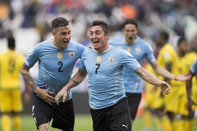 (150614) -- ANTOFAGASTA, June 14, 2015 -- Cristian Rodriguez (R) of Uruguay celebrates after scoring during a Group B match between Uruguay and Jamaica at Copa America 2015, in Antofagasta, Chile, on June 13, 2015. Uruguay won 1-0. ) (SP)CHILE-ANTOFAGASTA-COPA AMERICA-GROUP B-URUGUAY VS JAMAICA LuisxEcheverria 