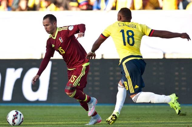 (150615) -- RANCAGUA, June 14, 2015 -- Colombia s Juan Zuniga (R) vies with Venezuela s Alejandro Guerra during a Group C match between Colombia and Venezuela at Copa America 2015 in Rancagua, Chile, June 14, 2015. Colombia lost the match 0-1.) (SP)CHILE-RANCAGUA-COPA AMERICA 2015-GROUP C-COLOMBIA VS VENEZUELA JorgexVillegas 
