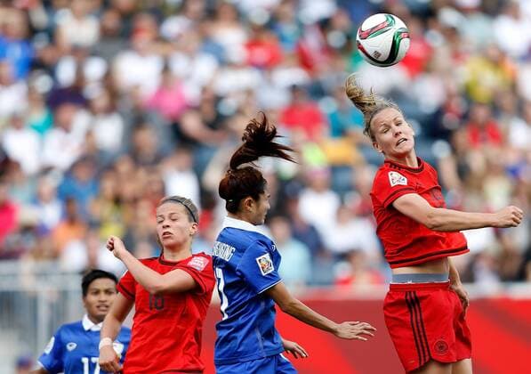 (150615) -- WINNIPEG, June 15, 2015 -- Melanie Leupolz(1st R) of Germany heads the ball during the Group B match between Germany and Thailand at Winnipeg Stadium in Winnipeg, Canada on June 15, 2015. Germany won 4-0. ) (SP)CANADA-WINNIPEG-FIFA WOMEN S WORLD CUP-GER VS THA WangxLili 